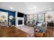 Cozy living room featuring a fireplace, plush seating, and lots of natural light from large windows at 242 Bering Ln, Summerville, SC 29486