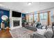Comfortable living room with a fireplace, soft lighting, and cozy seating at 242 Bering Ln, Summerville, SC 29486