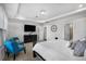 Main bedroom with a tray ceiling, neutral tones, and an ensuite bathroom at 242 Bering Ln, Summerville, SC 29486