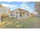 A spacious backyard featuring a covered patio, ideal for outdoor entertaining at 2598 Spivey Ct, North Charleston, SC 29406
