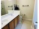 Bathroom features a double sink vanity, toilet, towel racks, and a standup shower at 2598 Spivey Ct, North Charleston, SC 29406