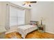 Inviting bedroom featuring a comfortable bed, hardwood floors, and a ceiling fan at 2598 Spivey Ct, North Charleston, SC 29406
