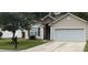 Charming home featuring a two-car garage, well-manicured lawn, and appealing curb appeal at 2598 Spivey Ct, North Charleston, SC 29406
