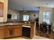 Open-concept kitchen featuring a breakfast bar and views of the living and dining areas at 2598 Spivey Ct, North Charleston, SC 29406