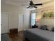 Comfortable main bedroom with hardwood floors, a ceiling fan, and two closets at 2598 Spivey Ct, North Charleston, SC 29406