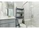 Bathroom featuring a glass enclosed shower, floating shelves and modern finishes at 3000 Flat Rock Ln, Ridgeville, SC 29472