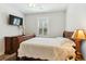 Bedroom features a wooden bed, dresser, neutral walls and natural light at 3000 Flat Rock Ln, Ridgeville, SC 29472