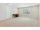 Unfurnished bonus room with a window, neutral carpet, and plenty of natural light at 3000 Flat Rock Ln, Ridgeville, SC 29472
