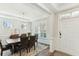 Bright dining room featuring elegant wainscoting, tray ceiling, hardwood floors, and large windows at 3000 Flat Rock Ln, Ridgeville, SC 29472