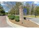 Carolina Bay entrance with sign, landscaping, and brick paved road at 3000 Flat Rock Ln, Ridgeville, SC 29472