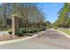 Carolina Bay entrance with brick pillar, signage, and manicured landscaping at 3000 Flat Rock Ln, Ridgeville, SC 29472
