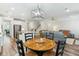 Open-concept kitchen and breakfast nook, with white cabinets, stainless steel appliances, and a cozy seating area at 3000 Flat Rock Ln, Ridgeville, SC 29472