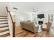 Spacious living room with wood flooring, a fireplace, and comfortable leather seating at 3000 Flat Rock Ln, Ridgeville, SC 29472