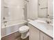 Bright bathroom features a white vanity, toilet, and a bathtub with tile surround at 307 Sedona Dr, Summerville, SC 29486