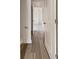 Bright hallway showcasing wood-look floors and white trim, creating a clean and welcoming transition space at 307 Sedona Dr, Summerville, SC 29486
