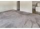 Spacious living room featuring neutral carpet and an open doorway to the kitchen area at 307 Sedona Dr, Summerville, SC 29486
