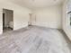 Bright main bedroom featuring neutral carpet and an open doorway to the bathroom area with natural light at 307 Sedona Dr, Summerville, SC 29486