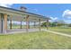 Open air pavilion with timber columns and concrete floor overlooks green fields at 326 Bradley Bend Dr, Moncks Corner, SC 29461