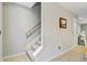 Carpeted staircase with wooden handrail, connecting floors and leading to cozy living spaces at 326 Bradley Bend Dr, Moncks Corner, SC 29461