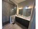 Bathroom featuring double sinks and a walk-in shower with rock floor at 3668 Maidstone Dr, Mount Pleasant, SC 29466