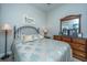 Inviting bedroom with a decorative headboard, a dresser with mirror, and neutral walls at 3668 Maidstone Dr, Mount Pleasant, SC 29466