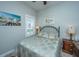 Comfortable bedroom with shuttered window, ceiling fan, and beach-themed decor at 3668 Maidstone Dr, Mount Pleasant, SC 29466