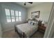 Guest bedroom showcases a cozy iron bed frame and shutters at 3668 Maidstone Dr, Mount Pleasant, SC 29466