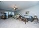 Spacious bonus room featuring lounge seating, bedroom area, and a fitness machine at 3668 Maidstone Dr, Mount Pleasant, SC 29466