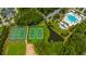 Aerial view of community pool, tennis courts, clubhouse and surrounding landscape at 3668 Maidstone Dr, Mount Pleasant, SC 29466