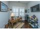 Bright home office with shuttered windows, a desk, and a shelf of collectibles at 3668 Maidstone Dr, Mount Pleasant, SC 29466
