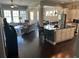 Open-concept living room with hardwood floors adjacent to kitchen island at 3668 Maidstone Dr, Mount Pleasant, SC 29466