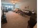 Spacious living room with a comfortable sofa, ceiling fan, and ample natural light creating a welcoming atmosphere at 3668 Maidstone Dr, Mount Pleasant, SC 29466