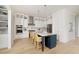 Modern kitchen with stainless steel appliances, a large island, and hardwood floors at 377 Blowing Fresh Dr, Charleston, SC 29492