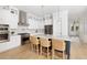 Elegant kitchen featuring an island with seating, stainless steel appliances, and custom cabinetry at 377 Blowing Fresh Dr, Charleston, SC 29492