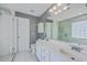 Elegant bathroom featuring double sinks, glass shower, and sleek fixtures for a spa-like experience at 401 Waring St, Summerville, SC 29483