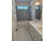 Well-lit bathroom featuring dual sinks and modern fixtures at 407 Sandridge Acres Trl, Holly Hill, SC 29059