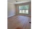 Light-filled bedroom with large window and neutral tones at 407 Sandridge Acres Trl, Holly Hill, SC 29059
