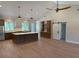 Bright, open-concept kitchen with a large island, stainless appliances, and vaulted ceilings at 407 Sandridge Acres Trl, Holly Hill, SC 29059