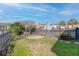 Fenced backyard with grass, shrubbery, a stone seating area and a clear blue sky above at 4237 William E Murray Blvd, Charleston, SC 29414