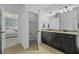 Bathroom showcasing a double sink vanity and an open doorway to the main bedroom at 4237 William E Murray Blvd, Charleston, SC 29414