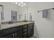 Bathroom featuring a double vanity with granite countertop and ample storage space below at 4237 William E Murray Blvd, Charleston, SC 29414