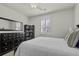 Well-lit bedroom with a window, ceiling fan, dresser, and modern decor; designed for comfort at 4237 William E Murray Blvd, Charleston, SC 29414