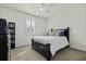 Cozy bedroom features a ceiling fan, shuttered window, and neutral walls, creating a relaxing retreat at 4237 William E Murray Blvd, Charleston, SC 29414