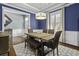 Inviting dining room with a rustic table, bench seating, and a contemporary chandelier at 4237 William E Murray Blvd, Charleston, SC 29414