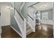 Inviting entryway with hardwood floors, staircase, and accent furniture at 4237 William E Murray Blvd, Charleston, SC 29414