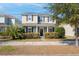 Traditional two-story home featuring a covered front porch and manicured landscaping at 4237 William E Murray Blvd, Charleston, SC 29414