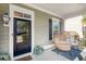Charming front porch with a unique wicker chair, perfect for relaxing outdoors at 4237 William E Murray Blvd, Charleston, SC 29414