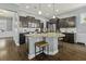 Spacious kitchen with dark wood cabinets, granite countertops, and stainless steel appliances at 4237 William E Murray Blvd, Charleston, SC 29414