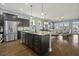 Kitchen island with stainless steel appliances, granite countertops and view to living area at 4237 William E Murray Blvd, Charleston, SC 29414