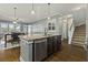 Kitchen island with stainless steel dishwasher, granite countertops and view to living area at 4237 William E Murray Blvd, Charleston, SC 29414